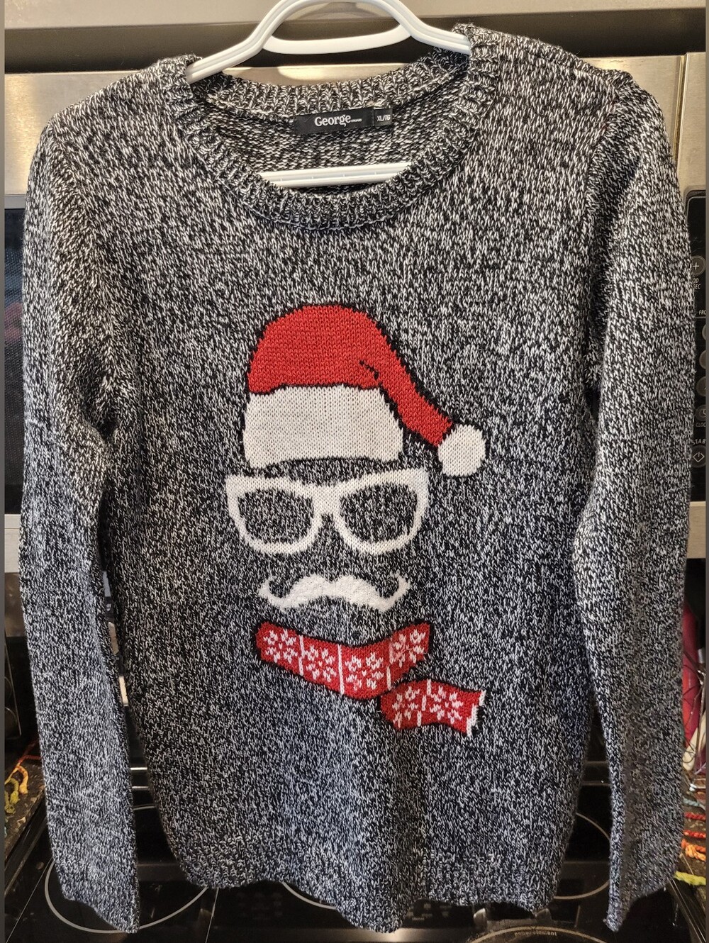 George Black & White Knit Sweater with Red Santa Accent